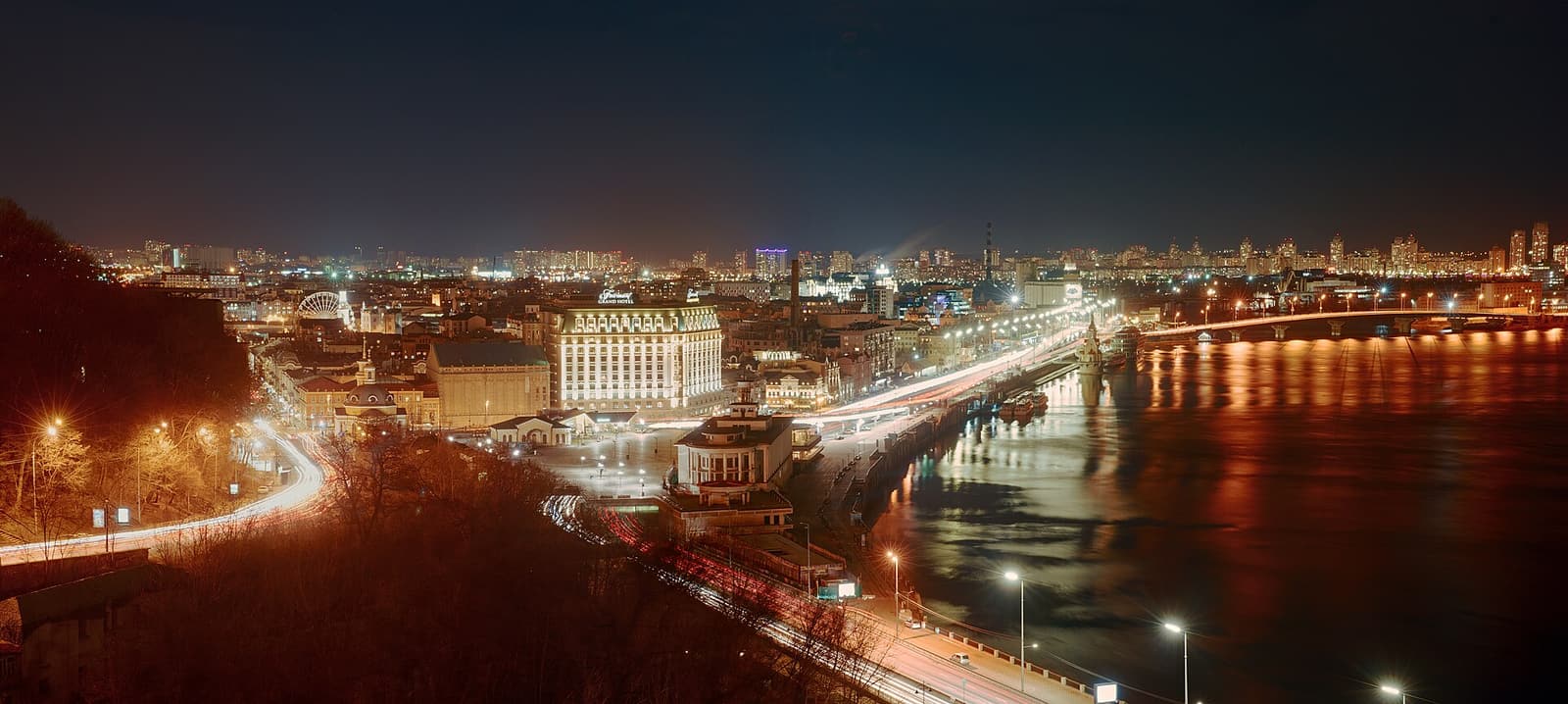 Kyiv's Podil district and the Dnipro river at night