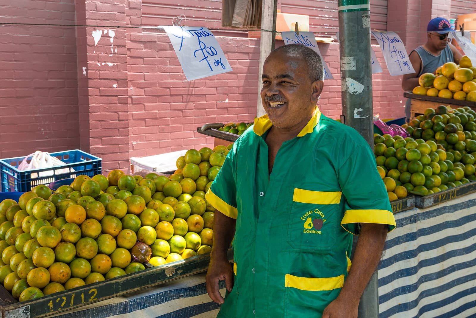 A fruit vendor at a street market in São Paulo