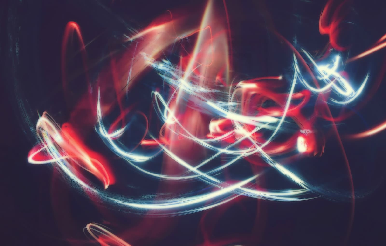 Streaks of light against a dark background